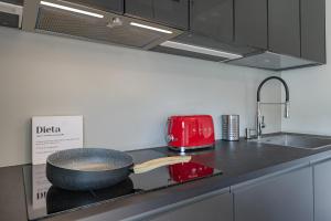 A kitchen or kitchenette at Giresio 41 - Your Penthouse with Rooftop Garden in Milano Navigli - WIFI