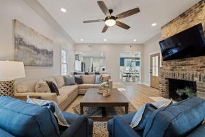 a living room with a couch and a fireplace at Tranquil Mountain Escape Luxurious 5-Bedroom Farmhouse with Pool in Maryville