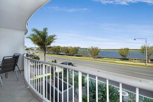 a view from a balcony of a balcony overlooking the ocean at Sandy Shores Holiday Units in Caloundra