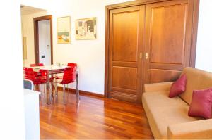 a living room with a couch and a table at Nel cuore di Oristano in Oristano