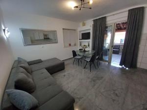 a living room with a couch and a table at Tara in Korčula