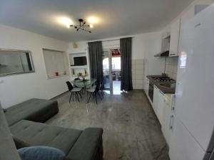 a living room with a couch and a table at Tara in Korčula