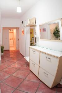 a kitchen with a red tiled floor at Alex Botique in Varna City