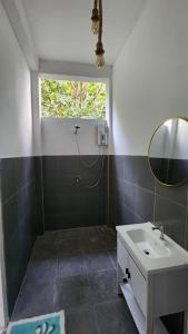 a bathroom with a sink and a mirror at Easy Life Koh Chang in Ko Chang