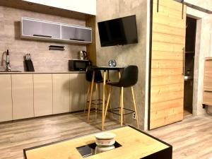 Kuchyň nebo kuchyňský kout v ubytování K&H Apartman