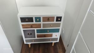 a small dresser in a room with at Apartament 4You in Żywiec