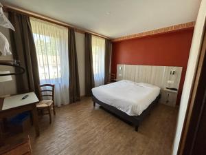 Postel nebo postele na pokoji v ubytování Auberge Des Mésanges