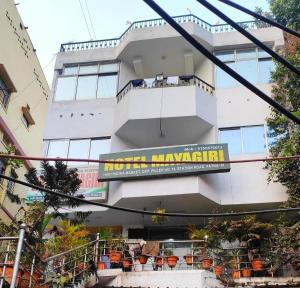 a hotel margarita sign in front of a building at Goroomgo Mayagiri Patna in Patna