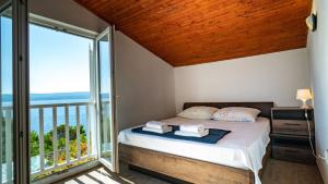 Postel nebo postele na pokoji v ubytování Holiday home Gandalj_2
