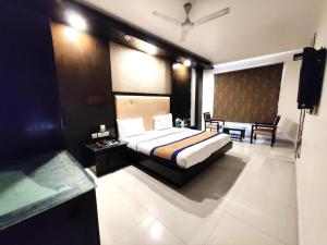 Postel nebo postele na pokoji v ubytování Hotel Delhi Pride, Karol Bagh