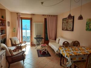 a living room with a couch and a table at Casa Angela Gravedona Consiglio di Rumo in Consiglio di Rumo