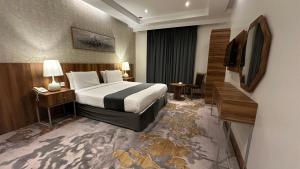 Postel nebo postele na pokoji v ubytování Multazam Al-Nnaseem Hotel