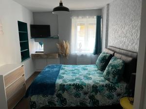 Postel nebo postele na pokoji v ubytování Chambre indépendante en toute autonomie