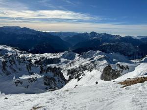 a view of a snow covered mountain with mountains at Appartment Isabelle Sky in Presseggersee