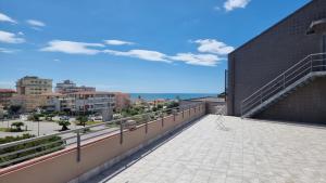 a balcony of a building with a view of a city at Residence le Dune in Lido di Camaiore