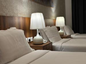 Postel nebo postele na pokoji v ubytování Multazam Al-Nnaseem Hotel