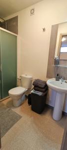 a bathroom with a toilet and a sink at FAMILY VILLA SUITE in Rome
