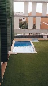 a swimming pool in the middle of a building at Lo raconet de Pilar in Sant Carles de la Ràpita