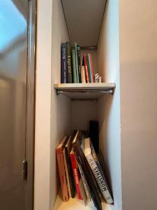 a book shelf filled with books on a wall at rhoazon heart in Rennes