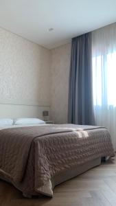 Postel nebo postele na pokoji v ubytování Hotel Poppi