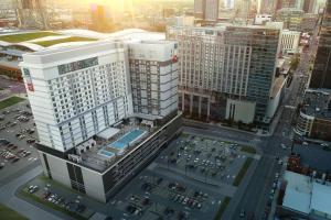 an aerial view of a tall building in a city at AC Hotel Nashville Downtown in Nashville