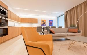 a living room with a couch and a table at 4 Bedroom Beautiful Home In Petrcane in Petrcane