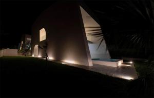 a house with lights on the side of it at night at 4 Bedroom Beautiful Home In Petrcane in Petrcane +23 photos