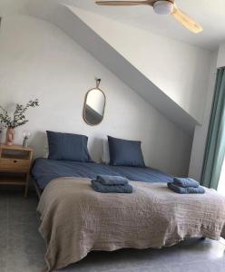 a bedroom with a bed with blue pillows on it at Al_andalus_404 in Alcossebre +49 photos