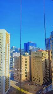 a view of a city with tall buildings at Live Like A Family Home away from Home near Manila Super Market Opposite SAHARA Center near Al Nahda Park NMC Center Sharjah in Sharjah