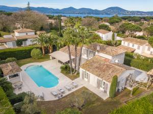 an aerial view of a house with a swimming pool at Villa le Roi Soleil in Saint-Tropez