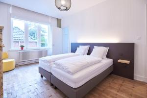 Postel nebo postele na pokoji v ubytování Maison Cambier