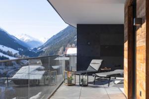 a balcony with a view of a mountain at Hollywood Dream Penthouse with private Sauna close Ischgl in Kappl