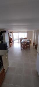 a kitchen and dining room with a table and chairs at Antorino in Balchik