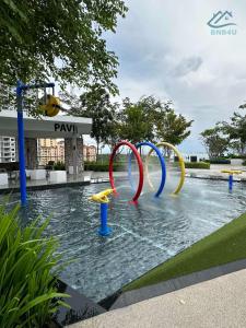 a pool with a water park with a water slide at Urban Suites @ George Town Penang by BNB4U in George Town