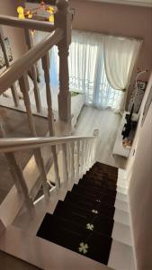 a stairway with a black and white carpet at Pension Haneul Tari in Jeju