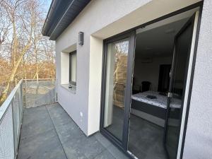 A balcony or terrace at Apartmány PREMIUM se soukromým parkováním