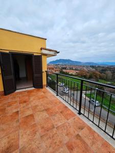 a balcony with a view of a city at Le Casette di Prissy in Rignano Flaminio