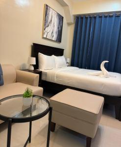 G Square Residences客房内的一张或多张床位
