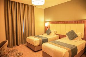 Postel nebo postele na pokoji v ubytování Demure -Razin Serviced Apartments + 59 fotografií