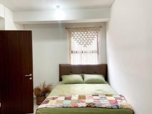 Postel nebo postele na pokoji v ubytování Apt Transpark Cibubur 2 BR With Wi-Fi & Pool