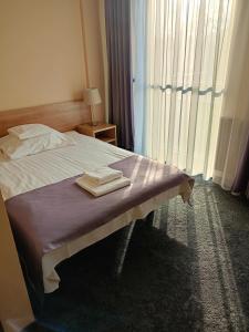 Letto o letti in una camera di Hotel Olimpijski