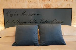 Postel nebo postele na pokoji v ubytování La Suite del Conte - STORIA, CONFORT ed ELEGANZA