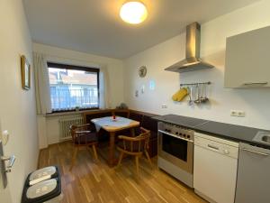 a kitchen with a table and a counter top at Sunny apartment in Pähl in Pähl