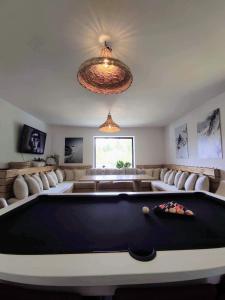 a living room with a pool table in it at Szafran Home Spa in Korbielów