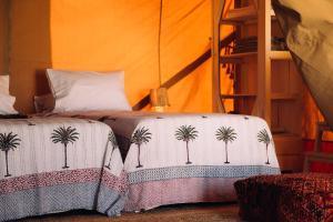 Postel nebo postele na pokoji v ubytování NOMAD GLAMPING