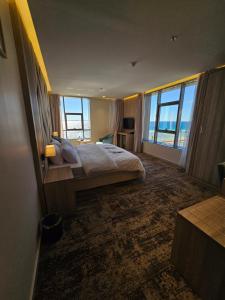 Postel nebo postele na pokoji v ubytování فندق سي قل - Sea gull Hotel