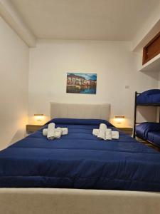 Posteľ alebo postele v izbe v ubytovaní Clary Home Cefalu'