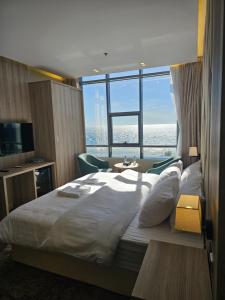 Postel nebo postele na pokoji v ubytování فندق سي قل - Sea gull Hotel