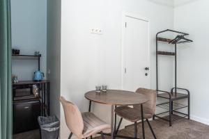 a dining room with a table and chairs at Van Lerius room in Antwerp