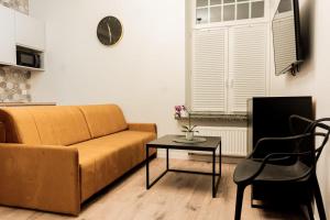 a living room with a couch and a table at VacationClub - Old Town Apartament 8B in Kłodzko